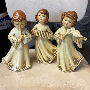 Vintage set of three chalk ware angel figurines playing music
